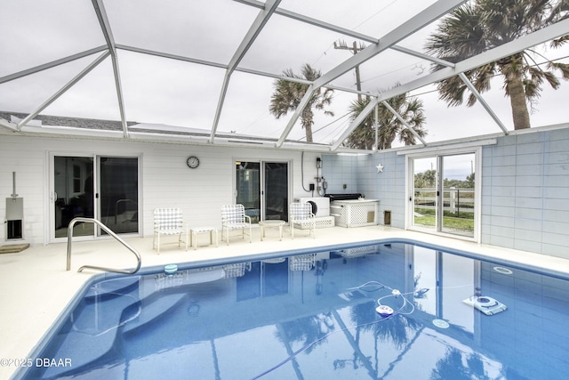 view of pool featuring a lanai, ac unit, and a patio