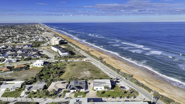 birds eye view of property featuring a water view and a view of the beach