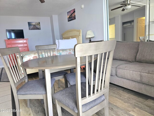 1233 S Atlantic Ave Unit 5270, Daytona Beach, FL 32118 - dining area with a ceiling fan and wood finished floors