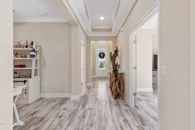 foyer featuring ornamental molding and light hardwood / wood-style floors