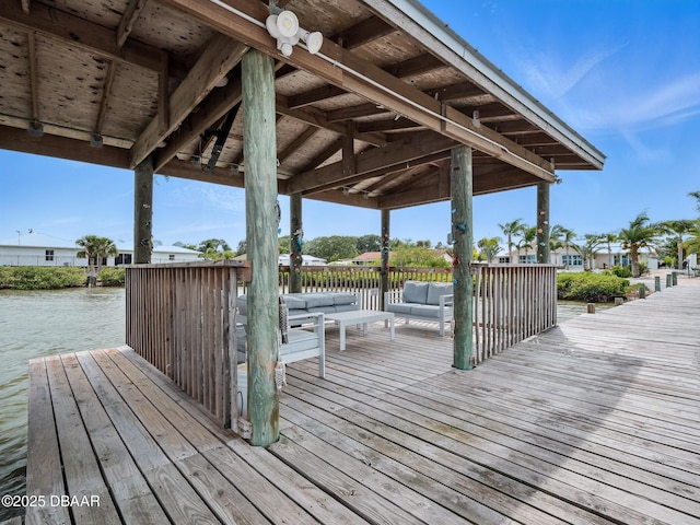 1601 S Riverside Dr, Edgewater, FL 32132 - wooden deck with outdoor lounge area and a water view