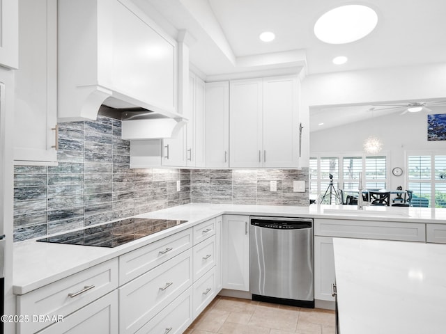 1601 S Riverside Dr, Edgewater, FL 32132 - kitchen with dishwasher, black electric stovetop, custom range hood, lofted ceiling, and decorative backsplash