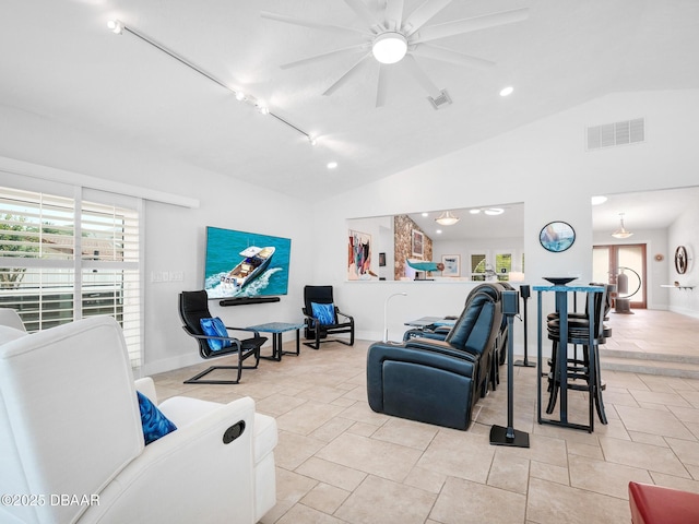 1601 S Riverside Dr, Edgewater, FL 32132 - living room with vaulted ceiling, ceiling fan, baseboards, and light tile patterned floors