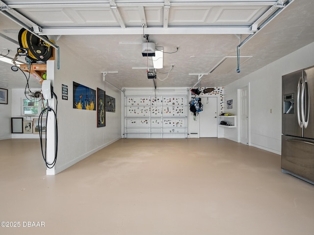 1601 S Riverside Dr, Edgewater, FL 32132 - garage featuring stainless steel fridge with ice dispenser