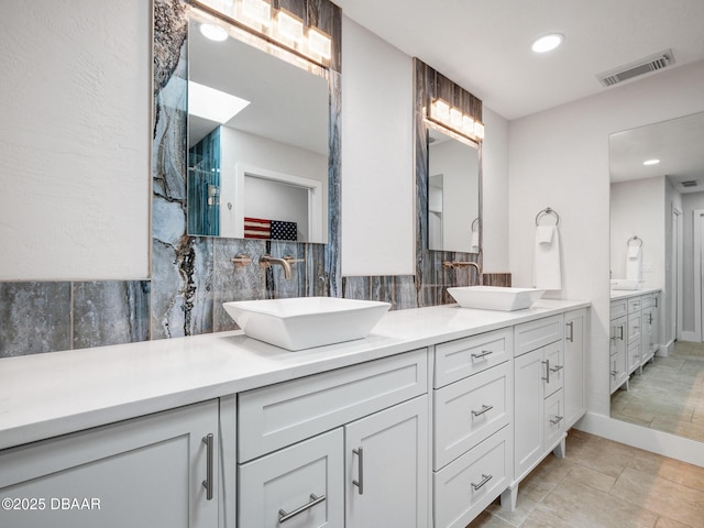 1601 S Riverside Dr, Edgewater, FL 32132 - full bath with tasteful backsplash, double vanity, and recessed lighting