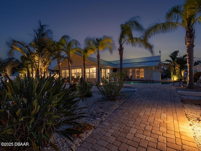 1601 S Riverside Dr, Edgewater, FL 32132 - view of front of home featuring an outdoor pool and a patio area