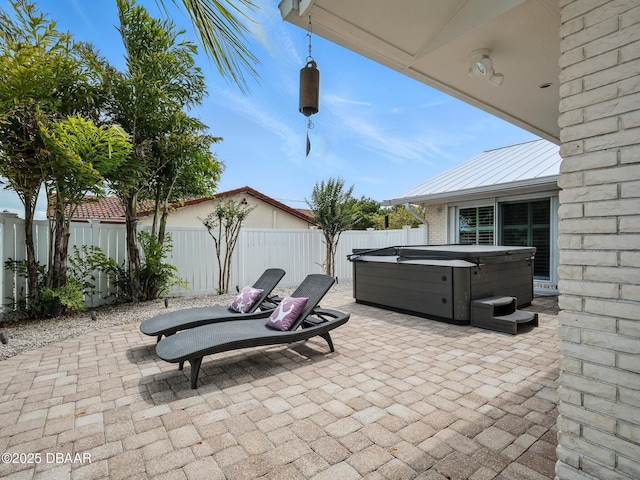 1601 S Riverside Dr, Edgewater, FL 32132 - fenced backyard with a hot tub and a patio area