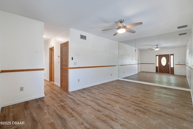 350 Citrus Club Dr, Merritt Island, FL 32953 - unfurnished room featuring a ceiling fan, wood finished floors, and baseboards