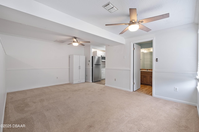 350 Citrus Club Dr, Merritt Island, FL 32953 - unfurnished living room featuring light colored carpet, ceiling fan, and baseboards