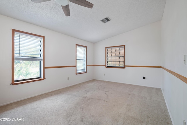 350 Citrus Club Dr, Merritt Island, FL 32953 - carpeted spare room featuring a ceiling fan, a textured ceiling, baseboards, and vaulted ceiling