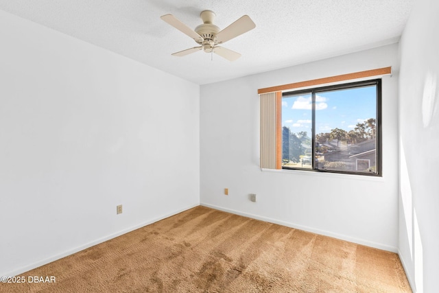 unfurnished room with carpet, a textured ceiling, and ceiling fan