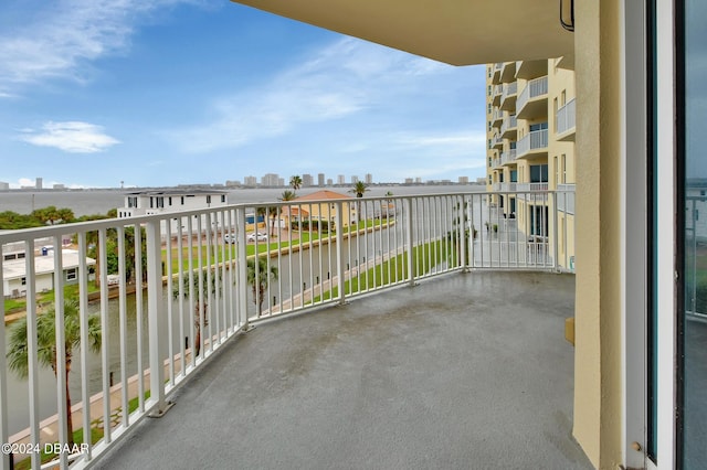 balcony featuring a water view