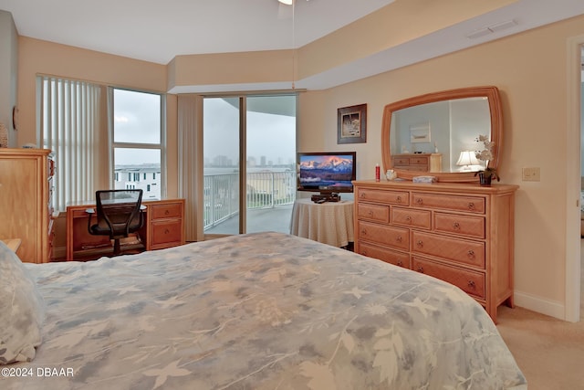 bedroom featuring access to outside and light carpet