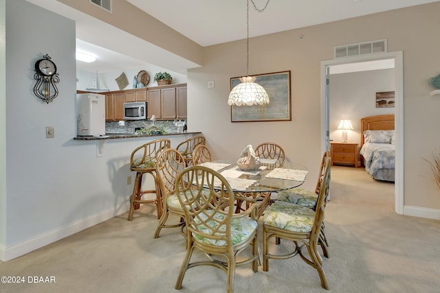 view of carpeted dining room