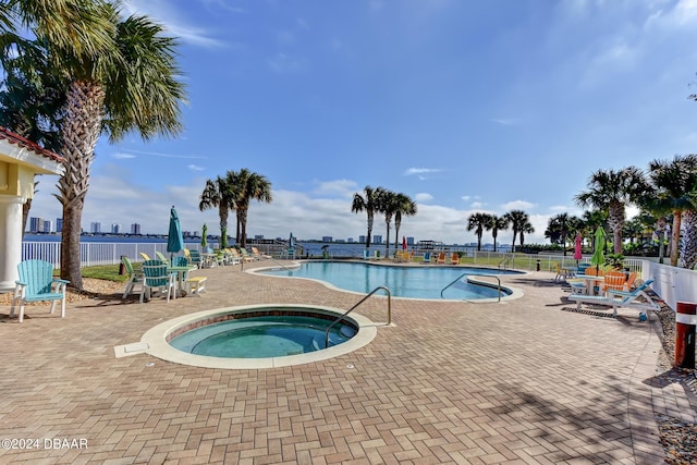 view of pool with a community hot tub and a patio area