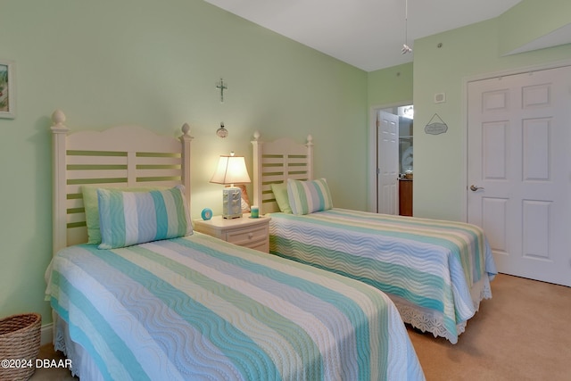 bedroom with light colored carpet