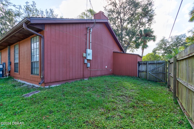 view of home's exterior with a yard