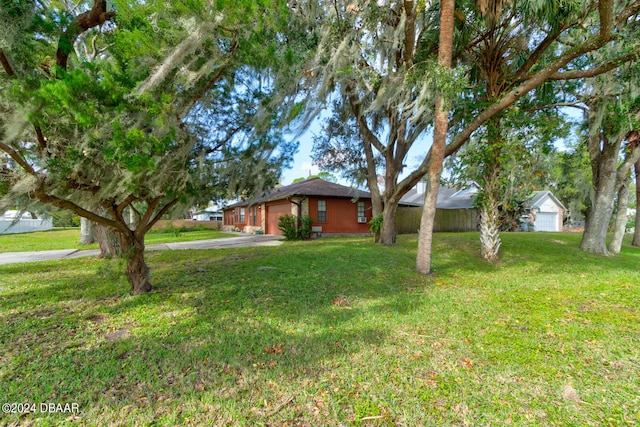 view of yard with a garage