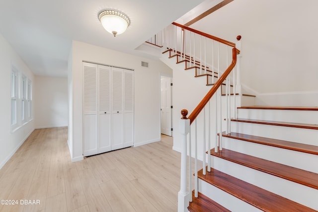 foyer entrance with light hardwood / wood-style flooring