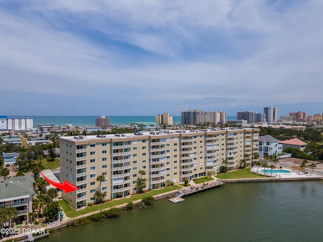 birds eye view of property featuring a water view