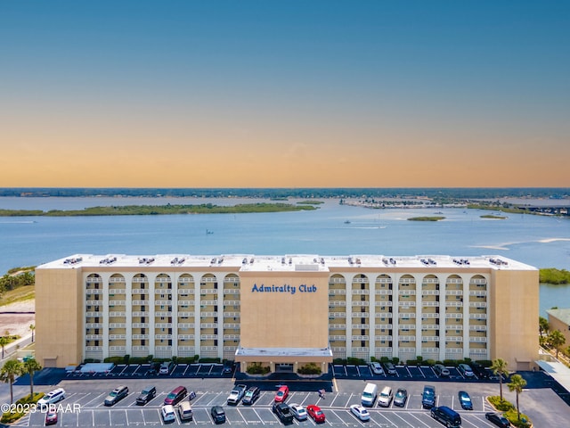 aerial view at dusk with a water view