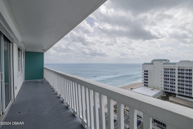 balcony with a beach view and a water view