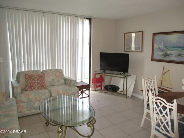 living room with light tile patterned floors and a textured ceiling