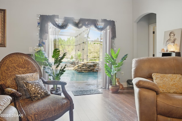 19343 Moorgate St, Orlando, FL 32833 - sitting room featuring arched walkways and wood finished floors