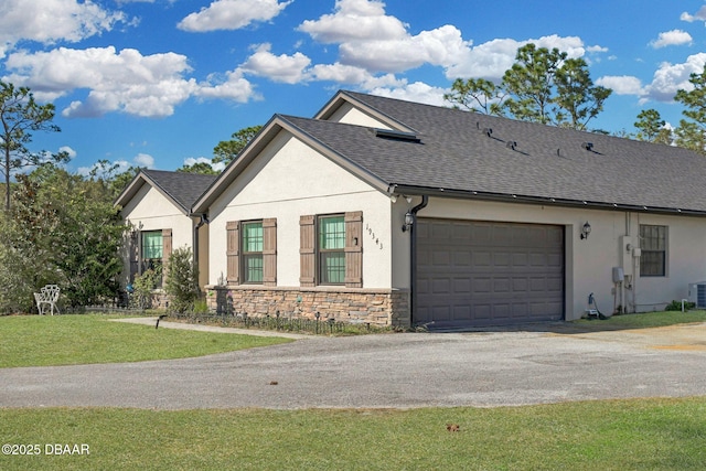 19343 Moorgate St, Orlando, FL 32833 - view of front facade with stucco siding, a garage, stone siding, and a shingled roof