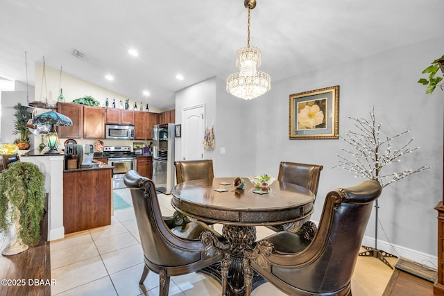 19343 Moorgate St, Orlando, FL 32833 - dining room featuring a chandelier, light tile patterned flooring, recessed lighting, and vaulted ceiling