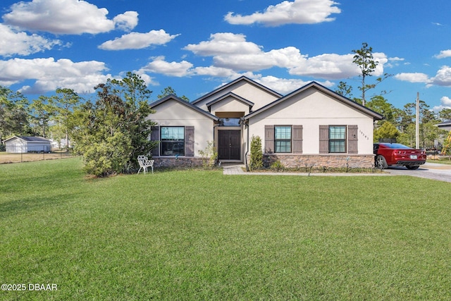 19343 Moorgate St, Orlando, FL 32833 - ranch-style home with stone siding, a front yard, and stucco siding