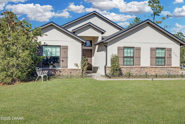 19343 Moorgate St, Orlando, FL 32833 - single story home featuring stone siding, stucco siding, and a front lawn