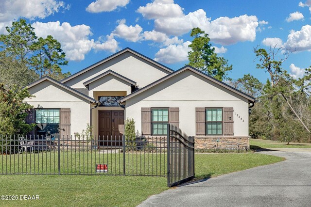 19343 Moorgate St, Orlando, FL 32833 - view of front of property with stucco siding, stone siding, and a gate