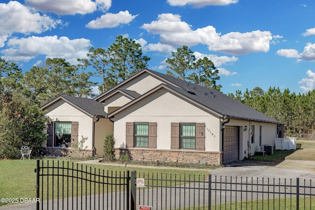 19343 Moorgate St, Orlando, FL 32833 - view of front of house with stone siding, stucco siding, an attached garage, central air condition unit, and driveway