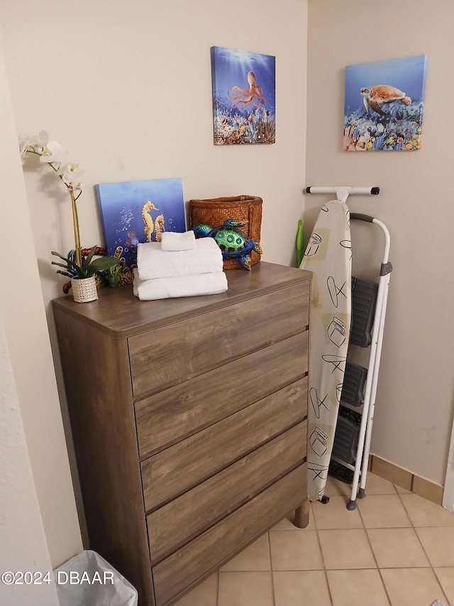 bedroom with light tile patterned floors