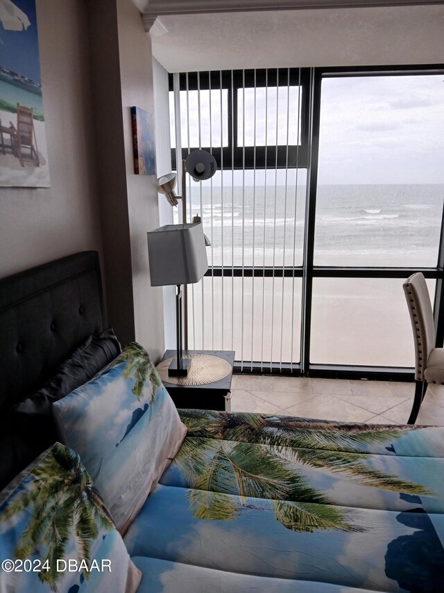 living room with a water view and a healthy amount of sunlight