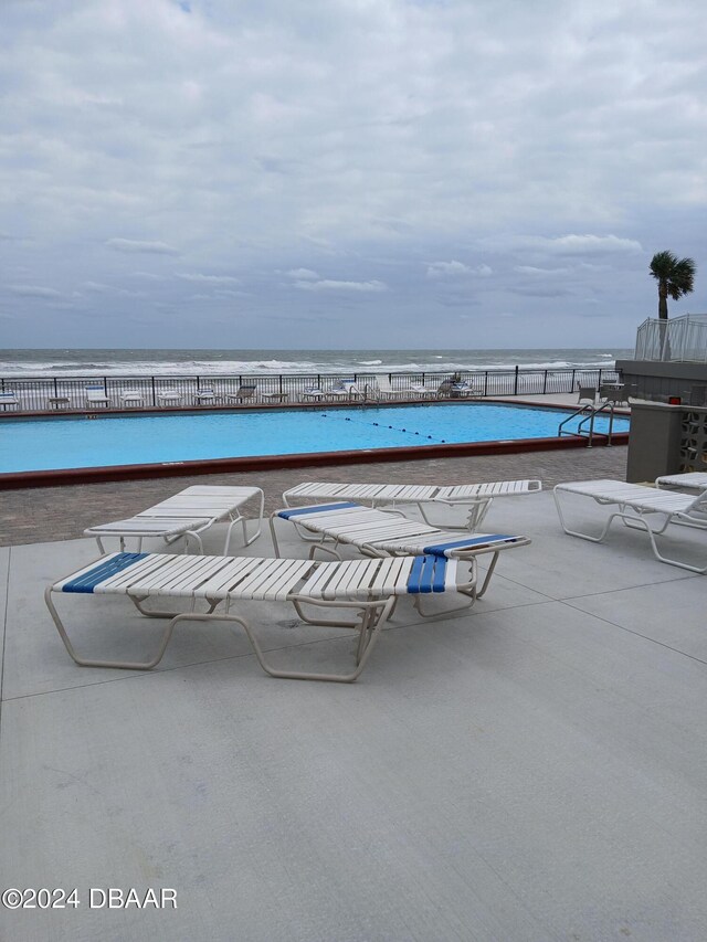 view of patio with a water view