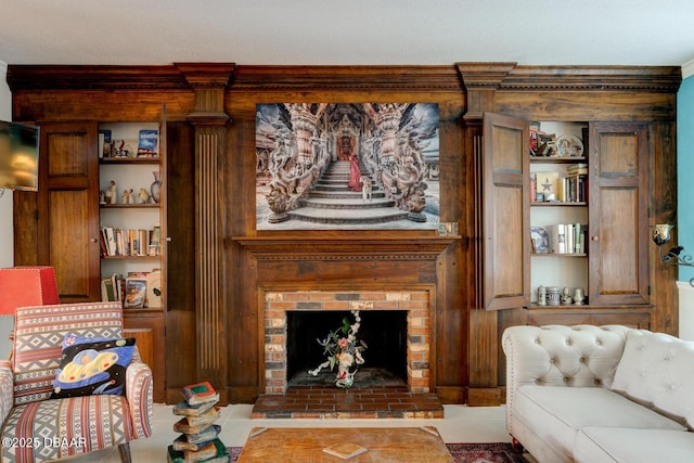 living room with a brick fireplace