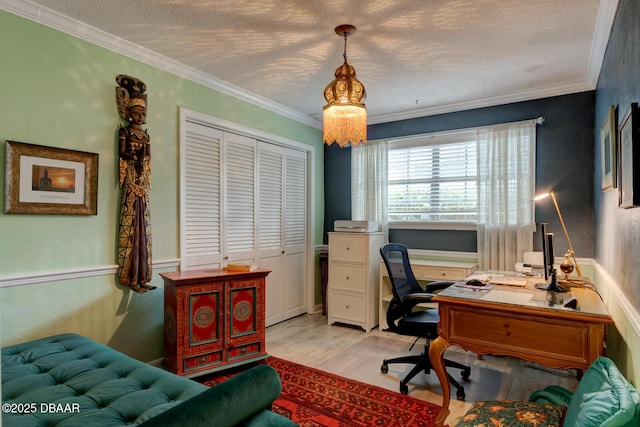 office space with light wood-style floors, crown molding, and a textured ceiling