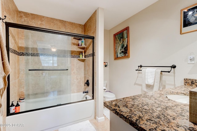 full bath with toilet, shower / bath combination with glass door, and vanity