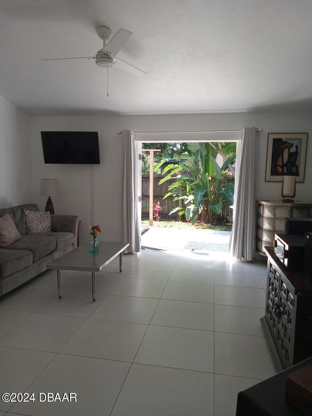 tiled living room featuring ceiling fan