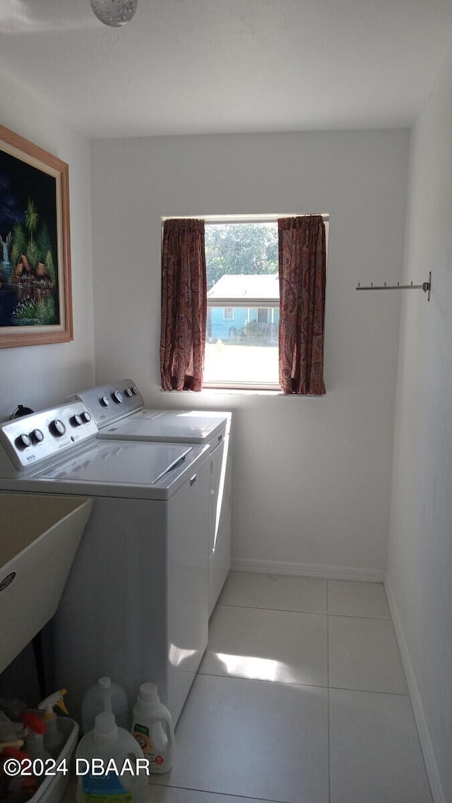 washroom featuring tile patterned floors and separate washer and dryer