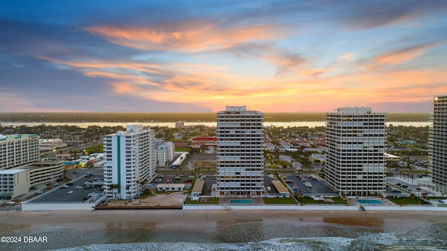 aerial view at dusk with a water view