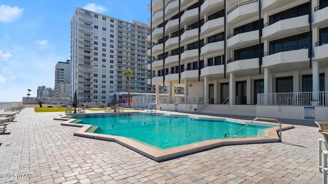 view of pool featuring a patio area