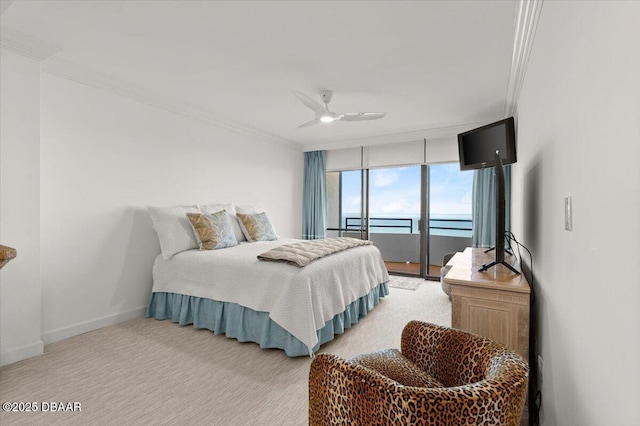 carpeted bedroom featuring crown molding and ceiling fan