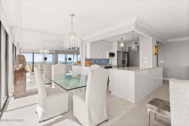 dining area featuring an inviting chandelier and crown molding