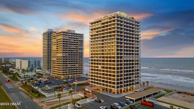 outdoor building at dusk with a water view and a beach view