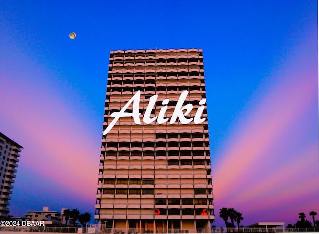 view of outdoor building at dusk