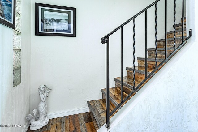 stairs with hardwood / wood-style flooring