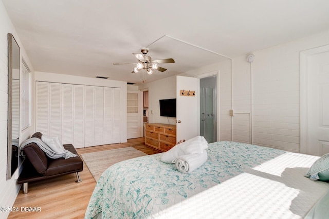 bedroom with hardwood / wood-style flooring and ceiling fan